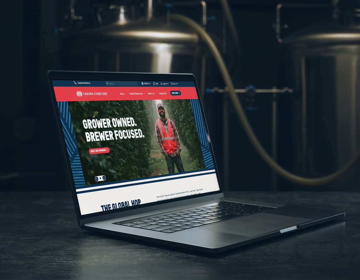 Laptop open to display new Yakima Chief Hops website on screen